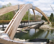 Conceptual and final design for the arches, Glue-Laminated timber design, Erection stability analysis, Detail preparation for arches and quality control review for remaining structure